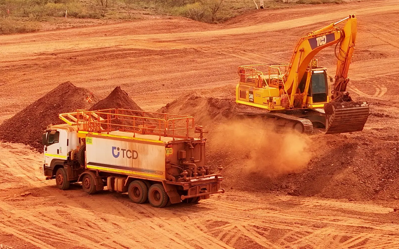 TCD water truck and excavator working on bulk earthworks for the Solomon Airport Solar Hub in the Pilbara