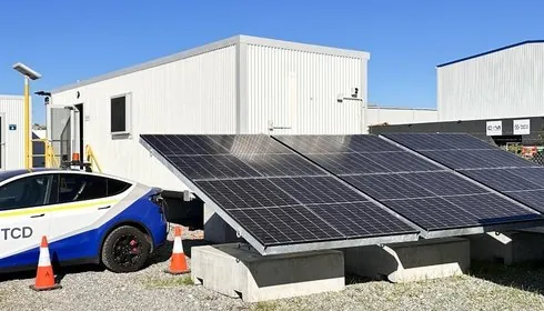 TCD site office with a solar array and an electric vehicle on a Pilbara mine site